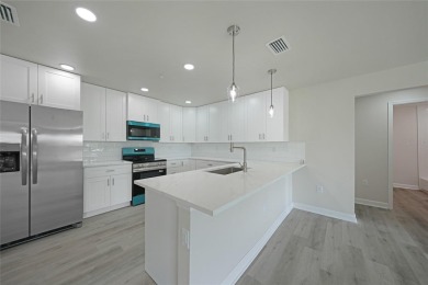 This nearly completed WATERFRONT TRIPLEX in Rotonda West, FL, is on Rotonda Golf and Country Club The Palms Course in Florida - for sale on GolfHomes.com, golf home, golf lot