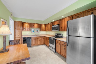 Wake up to tranquil lake and golf course views in this welcoming on Quail Ridge Golf Course and Country Club in Florida - for sale on GolfHomes.com, golf home, golf lot