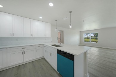 This nearly completed WATERFRONT TRIPLEX in Rotonda West, FL, is on Rotonda Golf and Country Club The Palms Course in Florida - for sale on GolfHomes.com, golf home, golf lot