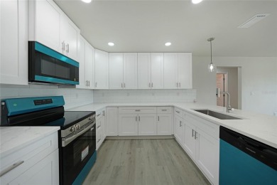 This nearly completed WATERFRONT TRIPLEX in Rotonda West, FL, is on Rotonda Golf and Country Club The Palms Course in Florida - for sale on GolfHomes.com, golf home, golf lot