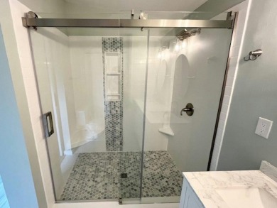 Beautifully renovated 2BD/2BA stucco home perfectly blends on Del Tura Golf and Country Club in Florida - for sale on GolfHomes.com, golf home, golf lot