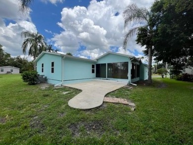 Beautifully renovated 2BD/2BA stucco home perfectly blends on Del Tura Golf and Country Club in Florida - for sale on GolfHomes.com, golf home, golf lot