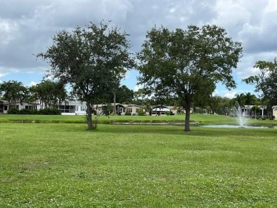 Beautifully renovated 2BD/2BA stucco home perfectly blends on Del Tura Golf and Country Club in Florida - for sale on GolfHomes.com, golf home, golf lot
