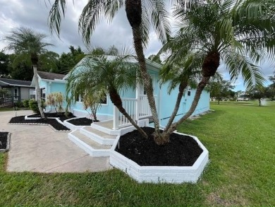 Beautifully renovated 2BD/2BA stucco home perfectly blends on Del Tura Golf and Country Club in Florida - for sale on GolfHomes.com, golf home, golf lot