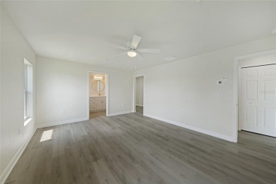 This nearly completed WATERFRONT TRIPLEX in Rotonda West, FL, is on Rotonda Golf and Country Club The Palms Course in Florida - for sale on GolfHomes.com, golf home, golf lot
