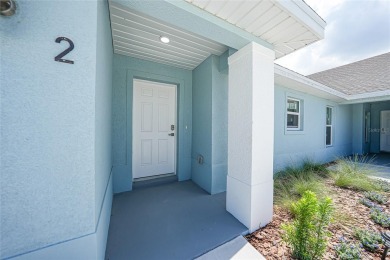 This nearly completed WATERFRONT TRIPLEX in Rotonda West, FL, is on Rotonda Golf and Country Club The Palms Course in Florida - for sale on GolfHomes.com, golf home, golf lot