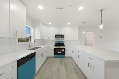 This nearly completed WATERFRONT TRIPLEX in Rotonda West, FL, is on Rotonda Golf and Country Club The Palms Course in Florida - for sale on GolfHomes.com, golf home, golf lot