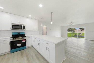 This nearly completed WATERFRONT TRIPLEX in Rotonda West, FL, is on Rotonda Golf and Country Club The Palms Course in Florida - for sale on GolfHomes.com, golf home, golf lot