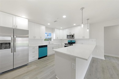 This nearly completed WATERFRONT TRIPLEX in Rotonda West, FL, is on Rotonda Golf and Country Club The Palms Course in Florida - for sale on GolfHomes.com, golf home, golf lot