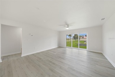 This nearly completed WATERFRONT TRIPLEX in Rotonda West, FL, is on Rotonda Golf and Country Club The Palms Course in Florida - for sale on GolfHomes.com, golf home, golf lot