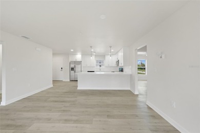 This nearly completed WATERFRONT TRIPLEX in Rotonda West, FL, is on Rotonda Golf and Country Club The Palms Course in Florida - for sale on GolfHomes.com, golf home, golf lot