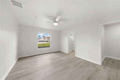 This nearly completed WATERFRONT TRIPLEX in Rotonda West, FL, is on Rotonda Golf and Country Club The Palms Course in Florida - for sale on GolfHomes.com, golf home, golf lot