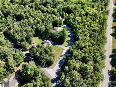 Surrounded by the beauty of nature, this parcel is close to golf on Twin Birch Golf Club in Michigan - for sale on GolfHomes.com, golf home, golf lot