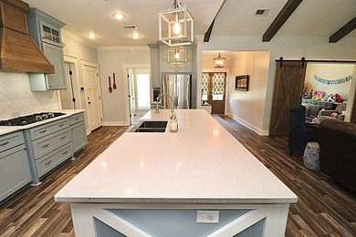 1.48 acres occupies this farmhouse style home with a on Stone Creek Golf Club in Georgia - for sale on GolfHomes.com, golf home, golf lot