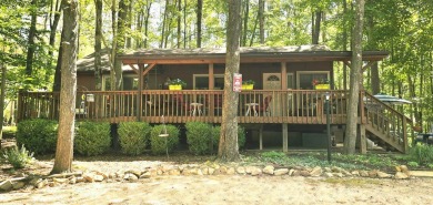 Welcome home to this wonderful 2 bedroom, 1 bath cabin in on Hide-A-Way Hills Golf Club in Ohio - for sale on GolfHomes.com, golf home, golf lot