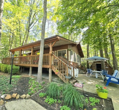 Welcome home to this wonderful 2 bedroom, 1 bath cabin in on Hide-A-Way Hills Golf Club in Ohio - for sale on GolfHomes.com, golf home, golf lot
