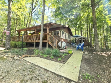 Welcome home to this wonderful 2 bedroom, 1 bath cabin in on Hide-A-Way Hills Golf Club in Ohio - for sale on GolfHomes.com, golf home, golf lot