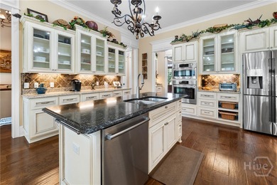 A custom masterpiece of luxury & craftmanship in the highly on Savannah Quarters Country Club in Georgia - for sale on GolfHomes.com, golf home, golf lot