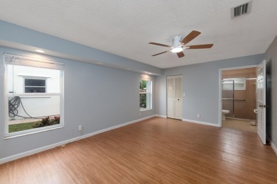 GORGEOUS, UPDATED, SKYLIGHTS, FANS, FRESHLY PAINTED, SCREENED on Forest Oaks Golf Club in Florida - for sale on GolfHomes.com, golf home, golf lot