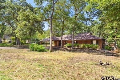 This home has so much potential and offers an affordable entry on Hide-A-Way Lake Golf Course in Texas - for sale on GolfHomes.com, golf home, golf lot