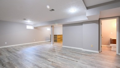 This Andover Forest brick home on a finished basement is full of on Andover Golf and Country Club in Kentucky - for sale on GolfHomes.com, golf home, golf lot