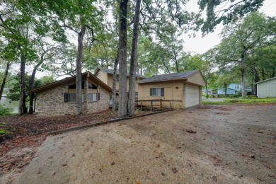 Nestled along the serene waterfront! on Hide-A-Way Lake Golf Course in Texas - for sale on GolfHomes.com, golf home, golf lot