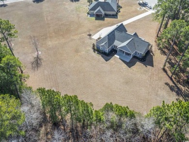 This stunning custom farmhouse-style home sits on a spacious 0 on Wild Wing Plantation in South Carolina - for sale on GolfHomes.com, golf home, golf lot