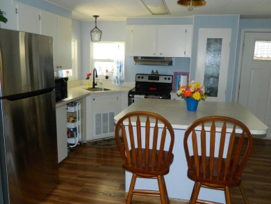 This 1984 Sherman home is 24x40 offering you 960 sq ft of open on Grasslands Golf and Country Club in Florida - for sale on GolfHomes.com, golf home, golf lot