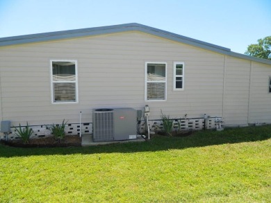 This 1984 Sherman home is 24x40 offering you 960 sq ft of open on Grasslands Golf and Country Club in Florida - for sale on GolfHomes.com, golf home, golf lot