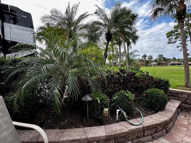 This stunning property is a masterpiece of elegance and on St. Lucie Trail Golf Club in Florida - for sale on GolfHomes.com, golf home, golf lot