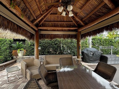 This stunning property is a masterpiece of elegance and on St. Lucie Trail Golf Club in Florida - for sale on GolfHomes.com, golf home, golf lot