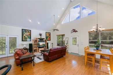 CUSTOM A-FRAME*LAKEFRONT HOME* | 3 Beds | 2 Baths | 1.5-Car on Seminole Lakes Country Club in Florida - for sale on GolfHomes.com, golf home, golf lot
