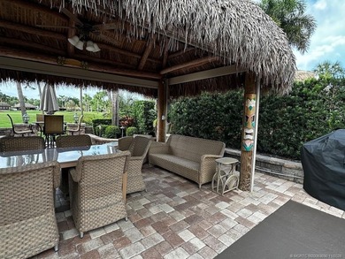 This stunning property is a masterpiece of elegance and on St. Lucie Trail Golf Club in Florida - for sale on GolfHomes.com, golf home, golf lot