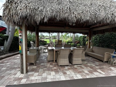 This stunning property is a masterpiece of elegance and on St. Lucie Trail Golf Club in Florida - for sale on GolfHomes.com, golf home, golf lot