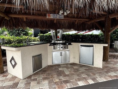 This stunning property is a masterpiece of elegance and on St. Lucie Trail Golf Club in Florida - for sale on GolfHomes.com, golf home, golf lot