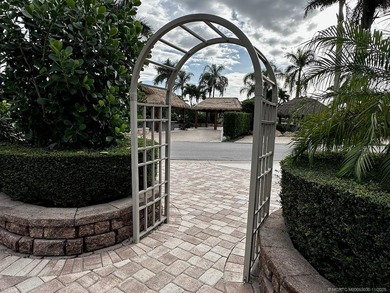 This stunning property is a masterpiece of elegance and on St. Lucie Trail Golf Club in Florida - for sale on GolfHomes.com, golf home, golf lot