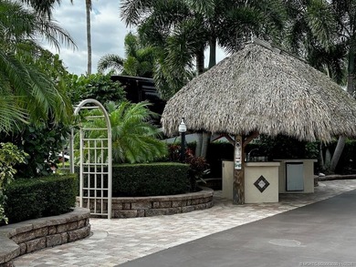 This stunning property is a masterpiece of elegance and on St. Lucie Trail Golf Club in Florida - for sale on GolfHomes.com, golf home, golf lot