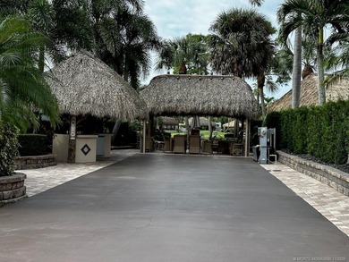 This stunning property is a masterpiece of elegance and on St. Lucie Trail Golf Club in Florida - for sale on GolfHomes.com, golf home, golf lot