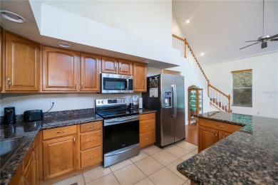 CUSTOM A-FRAME*LAKEFRONT HOME* | 3 Beds | 2 Baths | 1.5-Car on Seminole Lakes Country Club in Florida - for sale on GolfHomes.com, golf home, golf lot