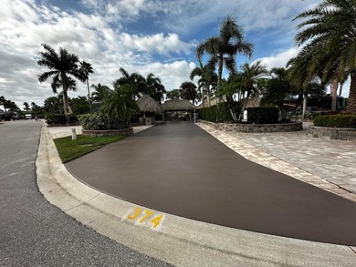 This stunning property is a masterpiece of elegance and on St. Lucie Trail Golf Club in Florida - for sale on GolfHomes.com, golf home, golf lot