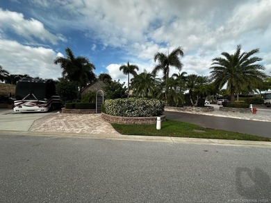This stunning property is a masterpiece of elegance and on St. Lucie Trail Golf Club in Florida - for sale on GolfHomes.com, golf home, golf lot