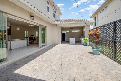 Discover this immaculate two-story Mediterranean-style home in on Eagle Creek Golf Club in Florida - for sale on GolfHomes.com, golf home, golf lot