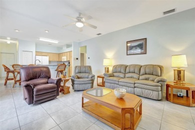 This beautifully maintained 4-bedroom home has been lovingly on Hunters Green Country Club in Florida - for sale on GolfHomes.com, golf home, golf lot