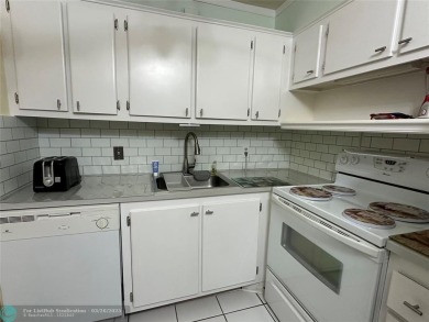 UNIT WITH NEW AIR CONDITIONING, NEW WATER HEATER, NEW FRENCH on Hillsboro Pines Golf in Florida - for sale on GolfHomes.com, golf home, golf lot