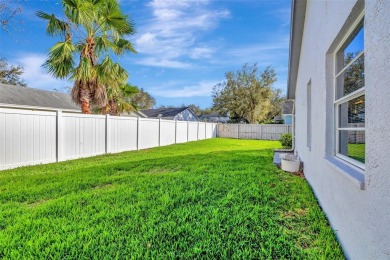 This beautifully maintained 4-bedroom home has been lovingly on Hunters Green Country Club in Florida - for sale on GolfHomes.com, golf home, golf lot