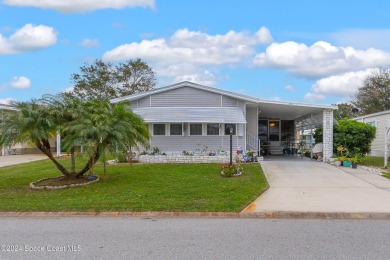 Welcome to this charming 2-bedroom, 2-bathroom manufactured home on Barefoot Bay Golf Course in Florida - for sale on GolfHomes.com, golf home, golf lot