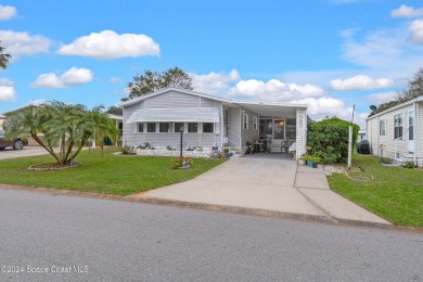 Welcome to this charming 2-bedroom, 2-bathroom manufactured home on Barefoot Bay Golf Course in Florida - for sale on GolfHomes.com, golf home, golf lot