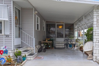 Welcome to this charming 2-bedroom, 2-bathroom manufactured home on Barefoot Bay Golf Course in Florida - for sale on GolfHomes.com, golf home, golf lot