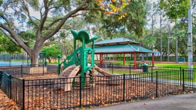 This beautifully maintained 4-bedroom home has been lovingly on Hunters Green Country Club in Florida - for sale on GolfHomes.com, golf home, golf lot