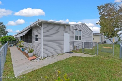 Welcome to this charming 2-bedroom, 2-bathroom manufactured home on Barefoot Bay Golf Course in Florida - for sale on GolfHomes.com, golf home, golf lot